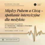 pomarańczowe tło, napisy i linia EKG